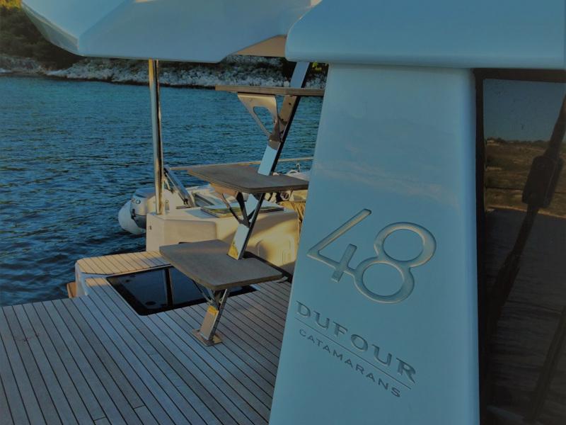 Book yachts online - catamaran - Dufour 48 Catamaran - NAMI NORI - COLOUR HULL, AC+GEN., UNDERWATER LIGHTS - rent